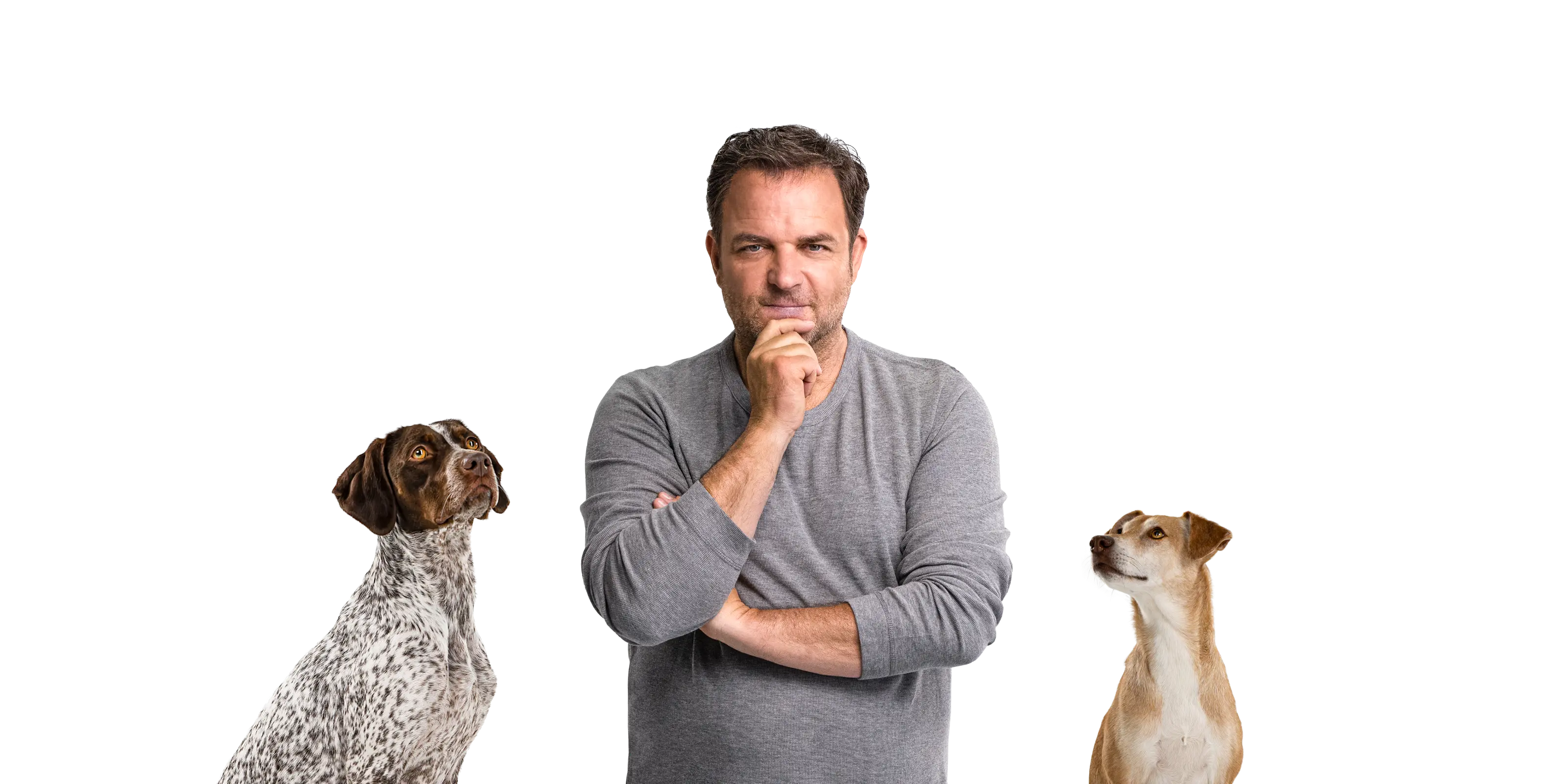 Porträt von Hundetrainer Martin Rütter mit zwei Hunden